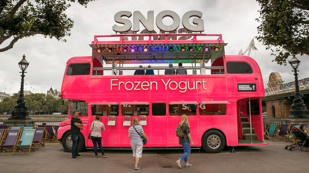 A bright pink bus selling Snog frozen yoghurt